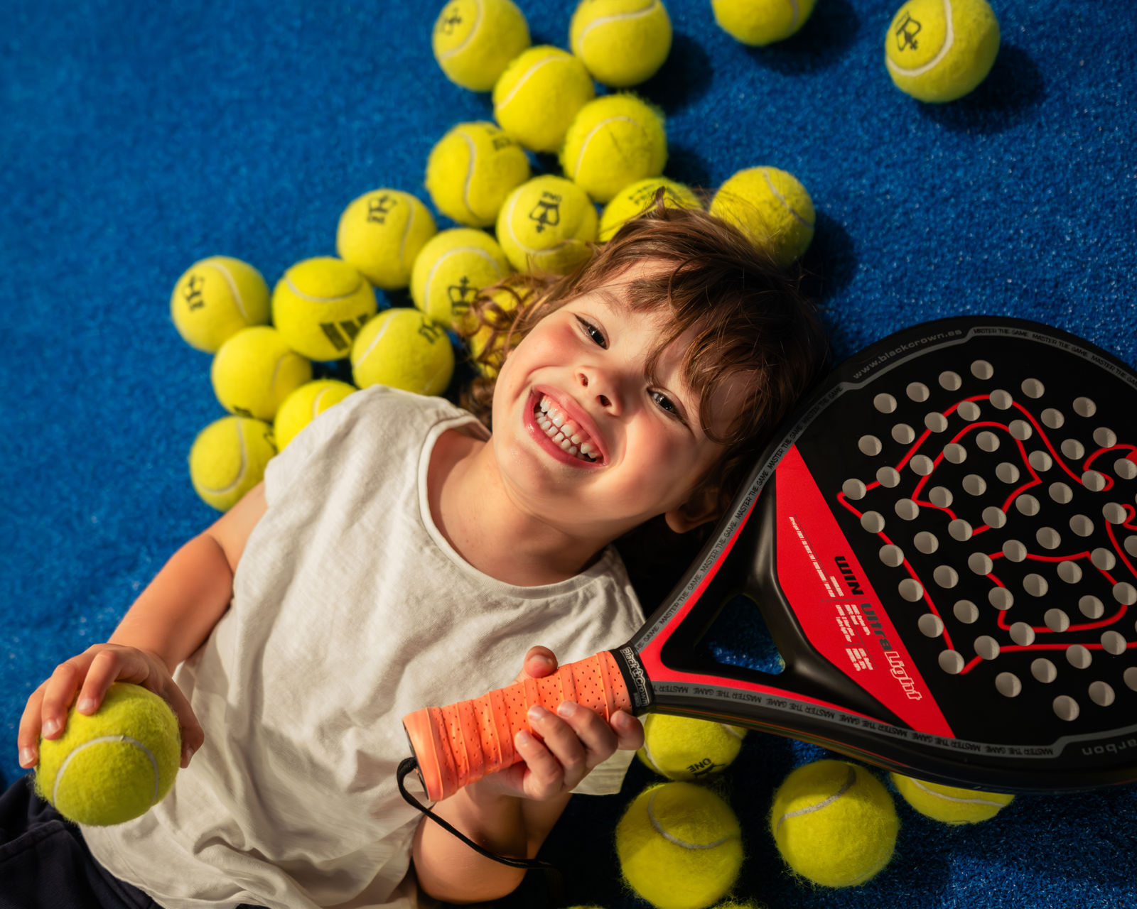 Junior padel at Les Ormes with rackets and balls